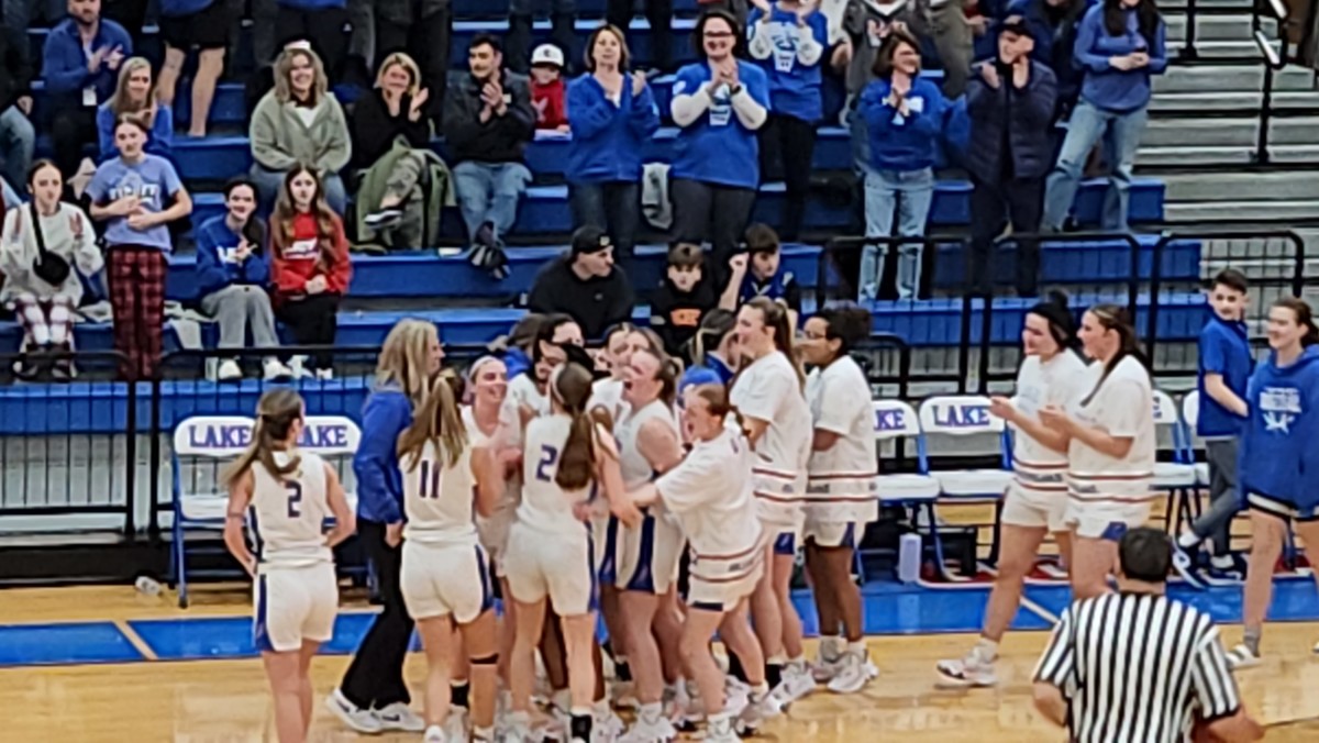 Lake girls basketball players celebrate a win over Jackson on January 24, 2024.